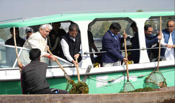 JK :LG Sinha leads cleanliness, de-weeding drive at Dal Lake in Srinagar
