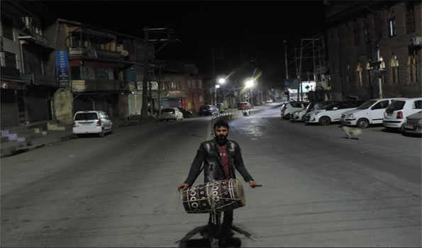 Shaqoor Sahar Khan keeps alive traditional drum beating to awake people for 'Sehri' in Srinagar