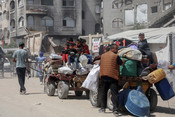 GAZA, May 17, 2025 (UNI/Xinhua) -- Displaced Palestinians are seen in Gaza City, as they flee with their belongings from Beit Lahia or Jabalia in northern Gaza Strip, on May 16, 2025. The Palestinian death toll from Israeli attacks in the northern Gaza Strip has surpassed 100 during the past 12 hours, the Civil Defense in Gaza said on Friday. Eyewitnesses and security sources reported that Israeli air and ground raids continued unabated since the early hours of the morning, targeting residential homes and shelters in Jabalia and Beit Lahia in the northern Gaza Strip. Some victims remain under the rubble where medical crews were unable to reach, they added.UNI PHOTO-2F GAZA, May 17, 2025 (UNI/Xinhua) -- Displaced Palestinians are seen in Gaza City, as they flee with their belongings from Beit Lahia or Jabalia in northern Gaza Strip, on May 16, 2025. The Palestinian death toll from Israeli attacks in the northern Gaza Strip has surpassed 100 during the past 12 hours, the Civil Defense in Gaza said on Friday. Eyewitnesses and security sources reported that Israeli air and ground raids continued unabated since the early hours of the morning, targeting residential homes and shelters in Jabalia and Beit Lahia in the northern Gaza Strip. Some victims remain under the rubble where medical crews were unable to reach, they added.UNI PHOTO-2F